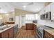 Spacious kitchen features granite counters, stainless appliances, and ample storage at 11396 Se 178Th Pl, Summerfield, FL 34491