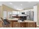 Modern kitchen with a large island, stainless steel appliances and recessed lighting at 11396 Se 178Th Pl, Summerfield, FL 34491