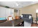 Inviting living area with built-in shelving, a comfortable sofa, and a calming color palette, great for relaxation at 11396 Se 178Th Pl, Summerfield, FL 34491