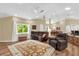 Bright and open living area with comfortable seating and seamless flow to dining area at 11396 Se 178Th Pl, Summerfield, FL 34491