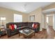 Comfortable living room with large sectional sofa and modern coffee table at 11396 Se 178Th Pl, Summerfield, FL 34491