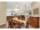 Open-concept living space with dining area, kitchen and expansive living room at 11396 Se 178Th Pl, Summerfield, FL 34491