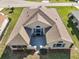 Overhead shot of the home featuring its roof, patio and lanai at 11684 Sw 72Nd Cir, Ocala, FL 34476