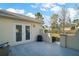 Backyard patio featuring a smooth concrete surface and stucco walls at 11684 Sw 72Nd Cir, Ocala, FL 34476