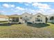 Backyard featuring mature landscaping, lanai and patio areas at 11684 Sw 72Nd Cir, Ocala, FL 34476
