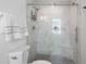 Modern bathroom featuring an enclosed shower with marble tile and sleek fixtures at 11684 Sw 72Nd Cir, Ocala, FL 34476