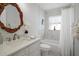 Stylish bathroom with a decorative mirror and marble accents in a well-lit space at 11684 Sw 72Nd Cir, Ocala, FL 34476