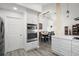Modern kitchen with built-in oven and microwave and adjacent dining area at 11684 Sw 72Nd Cir, Ocala, FL 34476