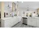Spacious kitchen with white countertops, stainless steel appliances, and island with cooktop at 11684 Sw 72Nd Cir, Ocala, FL 34476