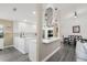 Bright kitchen with white cabinetry, stainless steel appliances, and an open dining area at 11684 Sw 72Nd Cir, Ocala, FL 34476