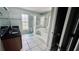 A spacious bathroom with double sinks, soaking tub, and glass-enclosed shower at 11727 Pineloch Loop, Clermont, FL 34711
