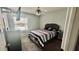 Bright bedroom featuring a charming bed, soft natural light, and neutral walls at 11727 Pineloch Loop, Clermont, FL 34711