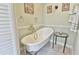 Bathroom featuring a stylish claw-foot bathtub and elegant fixtures at 1229 Augustine Dr, The Villages, FL 32159