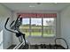 Exercise area with equipment and view of the backyard at 1229 Augustine Dr, The Villages, FL 32159