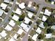 Aerial view of the neighborhood showcasing the layout of homes, streets, and green spaces at 1340 Elkhart Cir, Tavares, FL 32778