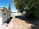 Private backyard with mature trees and partial home view, offering a serene outdoor space at 1340 Elkhart Cir, Tavares, FL 32778