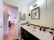 Bathroom featuring patterned shower curtain, checkerboard flooring, and a black vanity at 1340 Elkhart Cir, Tavares, FL 32778