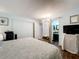 Comfortable bedroom with a bed, closet, and connected bath at 1340 Elkhart Cir, Tavares, FL 32778