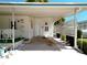 A covered carport provides shade and protection with convenient access to both front doors at 1340 Elkhart Cir, Tavares, FL 32778