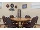 Game room features a large poker table, decorative poker-themed wall art, and neutral colored walls at 1340 Elkhart Cir, Tavares, FL 32778