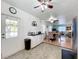 Convenient kitchen area with black countertops, seamlessly connected to the dining and living spaces at 1340 Elkhart Cir, Tavares, FL 32778