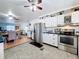 Well-equipped kitchen featuring stainless steel appliances and ample cabinet space at 1340 Elkhart Cir, Tavares, FL 32778