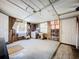 Spacious unfinished living room featuring two windows, a door to the exterior, and a blank canvas at 1340 Elkhart Cir, Tavares, FL 32778