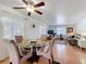Open-concept living space with dining area flowing into a comfortable living room at 1340 Elkhart Cir, Tavares, FL 32778