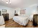 Serene main bedroom with soft blue walls, ample closet space, and hardwood floors at 1340 Elkhart Cir, Tavares, FL 32778