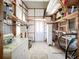 Utility room with built-in shelving and storage; showing the door to the exterior at 1340 Elkhart Cir, Tavares, FL 32778