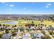 Beautiful aerial view of home in golf community, featuring lush landscaping and views at 1380 Mayesville Way, The Villages, FL 32162