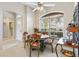 Cozy breakfast nook with a round table and chairs next to the kitchen at 1380 Mayesville Way, The Villages, FL 32162