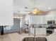 Modern kitchen with stainless steel appliances and white cabinets at 1380 Mayesville Way, The Villages, FL 32162