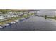 Scenic aerial view of a waterfront community featuring a boat dock and a charming lighthouse at 1401 W Highway 50 # 173, Clermont, FL 34711