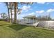 Scenic backyard featuring a covered boat dock with seating area on a tranquil waterfront setting at 1401 W Highway 50 # 173, Clermont, FL 34711