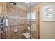 Accessible bathroom featuring a walk-in shower with handrails and built-in seat at 1401 W Highway 50 # 173, Clermont, FL 34711