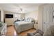 Comfortable main bedroom with abundant natural light, ceiling fan, and hardwood floors at 1401 W Highway 50 # 173, Clermont, FL 34711