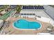 Overhead shot of community pool with a surrounding brick patio and plenty of seating at 1401 W Highway 50 # 173, Clermont, FL 34711