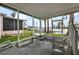Screened porch with seating and a table overlooking waterfront view with boat dock at 1401 W Highway 50 # 173, Clermont, FL 34711