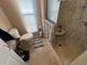 Compact bathroom featuring a step-in shower, toilet, and vanity, designed for functionality at 146 Jacaranda Dr, Leesburg, FL 34748