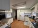 Functional kitchen with white cabinets, modern appliances, and ample counter space at 146 Jacaranda Dr, Leesburg, FL 34748