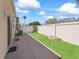 Secluded backyard showing the patio, small garden areas, and privacy fence at 1487 Gantt St, The Villages, FL 32162