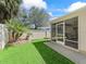 Lush backyard featuring a patio and privacy fence at 1487 Gantt St, The Villages, FL 32162
