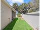 Picture of backyard that has short grass and a wall along the end and left side at 1487 Gantt St, The Villages, FL 32162