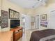 View of a bedroom showing the decorations, paint color and a doorway to another room at 1487 Gantt St, The Villages, FL 32162