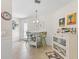 Cozy breakfast nook with seating for two, features stylish decor, and natural light, great for meals at 1487 Gantt St, The Villages, FL 32162