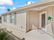 Charming home entrance features a decorative glass door, window shutters, and a welcoming doormat at 1487 Gantt St, The Villages, FL 32162