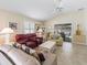 Inviting living room with sliding glass doors to the outside patio and comfortable seating at 1487 Gantt St, The Villages, FL 32162