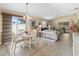 Bright open living space featuring a dining area, comfortable seating, and access to an outdoor area at 1487 Gantt St, The Villages, FL 32162