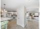 Inviting open floor plan showcases a modern kitchen, dining area, and living room with tile flooring at 1487 Gantt St, The Villages, FL 32162